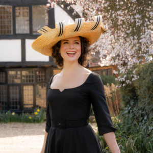 natural and black dramatic straw braid hat, classic but unique