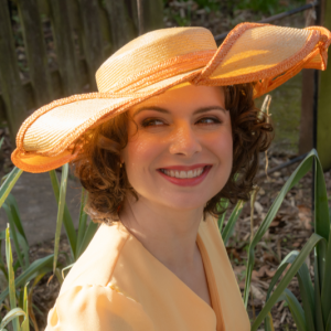 pale yellow straw and orange twisted braid brim