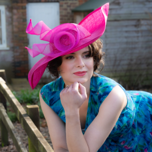Bright pink waved hat with crinoline trim, modern and contemporary millinery