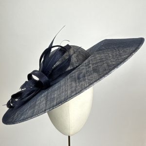 navy and mettalic silver hat with rose underneath the brim for mother of the bride