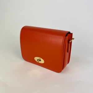 burnt orange leather clutch bag