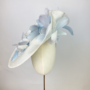 Ivory and pale blue feathered waved dramatic ascot hat